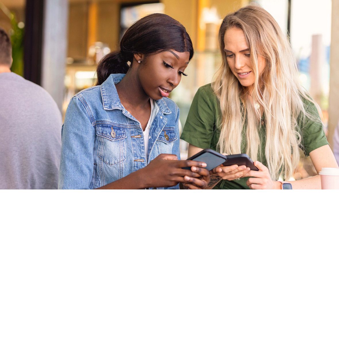 two girls looking at their mobile